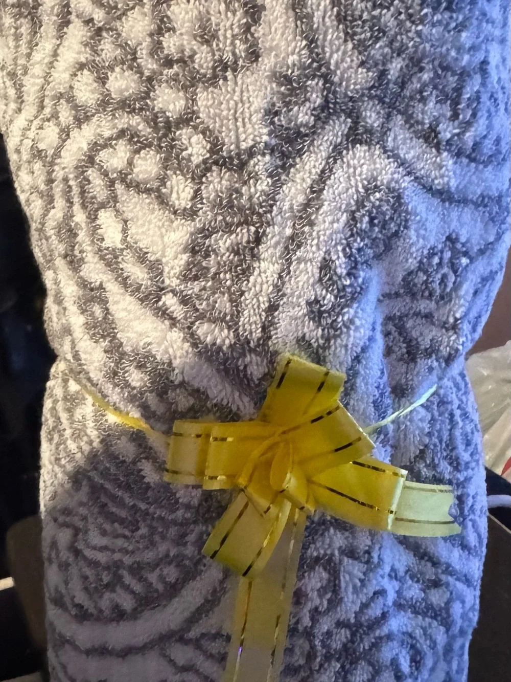 Gray Patterned Plush Towel with Yellow Decorative Bow